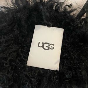Small UGG black Mongolian sheepskin bag.